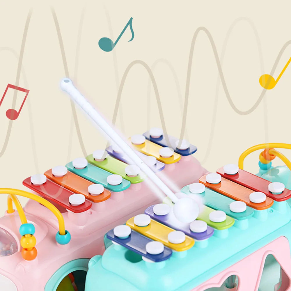 Let your little one explore the world of music and creativity with the Huanger 3-in-1 Music Xylophone Bus! Designed to entertain and educate, this multi-functional toy features a xylophone, piano keys, and shape-sorting blocks, making playtime both fun and educational.