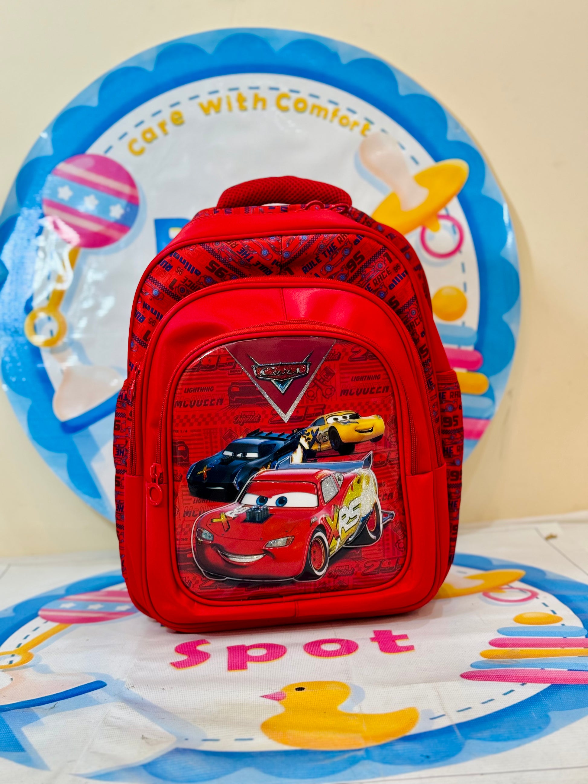 Get your little racer ready for school with this 16-inch adventure-packed school bag! Designed for kids who love speed and excitement, this backpack features a spacious main compartment to fit books, notebooks, and folders with ease. A front pocket keeps smaller essentials handy, while two mesh side pockets provide space for water bottles or snacks.