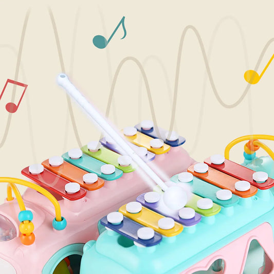 Let your little one explore the world of music and creativity with the Huanger 3-in-1 Music Xylophone Bus! Designed to entertain and educate, this multi-functional toy features a xylophone, piano keys, and shape-sorting blocks, making playtime both fun and educational.