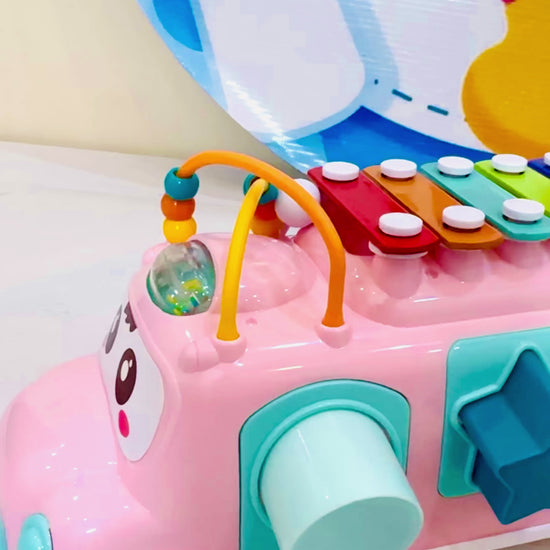 Let your little one explore the world of music and creativity with the Huanger 3-in-1 Music Xylophone Bus! Designed to entertain and educate, this multi-functional toy features a xylophone, piano keys, and shape-sorting blocks, making playtime both fun and educational.